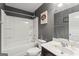 Clean bathroom with a shower-tub combination, white fixtures, and a vanity sink at 6870 Diamond Dr, Rex, GA 30273