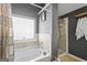 The bathroom features a tub with tile surround, framed mirror, and separate walk-in shower at 6870 Diamond Dr, Rex, GA 30273