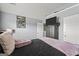 Chic bedroom with a modern bed frame, gray walls, and natural light at 6870 Diamond Dr, Rex, GA 30273