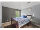 Comfortable bedroom with plush carpet, gray walls, and a window view at 6870 Diamond Dr, Rex, GA 30273