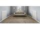 This bonus room features neutral walls and carpeting with a comfortable sofa at 6870 Diamond Dr, Rex, GA 30273