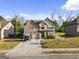 Charming two-story home with a well-maintained lawn and a two-car garage in a suburban setting at 6870 Diamond Dr, Rex, GA 30273