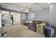 Comfortable living room with sectional sofa, neutral carpet, and an open view into the kitchen at 6870 Diamond Dr, Rex, GA 30273