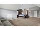 This main bedroom features a four-poster bed, neutral colored walls, and comfortable carpeting at 6870 Diamond Dr, Rex, GA 30273