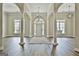 Spacious foyer with hardwood floors, columns, and ample natural light at 410 Denton Cir, Fayetteville, GA 30215
