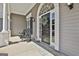 Welcoming front porch with rocking chairs, decorative wreath, and a patterned welcome mat at 410 Denton Cir, Fayetteville, GA 30215