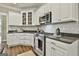 Close up of kitchen with stainless steel appliances and granite countertops, with ample cabinet space at 410 Denton Cir, Fayetteville, GA 30215