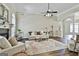 Comfortable living room with fireplace, ceiling fan, and stylish decor at 410 Denton Cir, Fayetteville, GA 30215