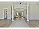 Bright and airy living room featuring hardwood floors, fireplace, and arched entryway at 410 Denton Cir, Fayetteville, GA 30215