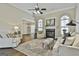 Elegant living room boasts high ceilings, fireplace, and plenty of natural light at 410 Denton Cir, Fayetteville, GA 30215