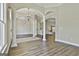 Open-concept living area with hardwood floors, columns, and natural light at 410 Denton Cir, Fayetteville, GA 30215