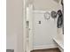 Mudroom with coat hooks, bench, and access to the laundry room at 410 Denton Cir, Fayetteville, GA 30215