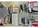 Walk-in closet with custom shelving and hanging rods to maximize storage at 410 Denton Cir, Fayetteville, GA 30215