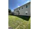 Large, grassy backyard with full sunlight, fenced-in perimeter, and a concrete patio at 2470 Wevok Way, Grayson, GA 30017