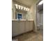 Bathroom featuring a double sink vanity with white cabinets, tile flooring, and a shower/tub combo at 2470 Wevok Way, Grayson, GA 30017