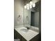 Bathroom featuring a white vanity, mirror, and vanity lights at 2470 Wevok Way, Grayson, GA 30017