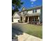 Charming two-story home featuring brick accents, a well-manicured lawn, and a welcoming entrance at 2470 Wevok Way, Grayson, GA 30017
