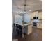 Bright, modern kitchen with stainless steel appliances, granite counters, and a large island with barstools at 2470 Wevok Way, Grayson, GA 30017