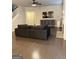 Comfortable living room with a gray couch, fireplace, and dark hardwood flooring at 2470 Wevok Way, Grayson, GA 30017
