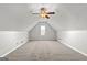 Spacious finished attic featuring neutral carpet and a ceiling fan, perfect for extra living space at 140 Jodeco Station Ter, Stockbridge, GA 30281