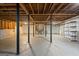 Large unfinished basement featuring concrete floor, exposed ceiling, and supporting columns, offering room to design at 140 Jodeco Station Ter, Stockbridge, GA 30281