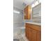 Bathroom featuring a shower-tub combo, wooden vanity, and updated fixtures at 140 Jodeco Station Ter, Stockbridge, GA 30281