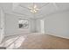 The main bedroom with tray ceiling and neutral colors offers a peaceful retreat at 140 Jodeco Station Ter, Stockbridge, GA 30281