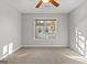 Bright bedroom featuring neutral carpet and a window with natural light at 140 Jodeco Station Ter, Stockbridge, GA 30281