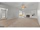 Spacious living room features a fireplace and a ceiling fan at 140 Jodeco Station Ter, Stockbridge, GA 30281