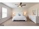 Serene bedroom with white furnishings, soft lighting, and a comfortable bed at 2369 Argento Cir, Dacula, GA 30019