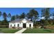 Charming community clubhouse with well-maintained lawn and adjacent playground equipment at 2369 Argento Cir, Dacula, GA 30019
