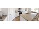Bright kitchen with stainless steel appliances, granite countertops, a center island, and a dining area at 2369 Argento Cir, Dacula, GA 30019