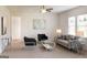 Spacious living room with modern furniture, large windows, and stylish decor at 2369 Argento Cir, Dacula, GA 30019