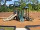 Community playground features multiple slides, climbing wall, and soft ground cover for safety at 2369 Argento Cir, Dacula, GA 30019