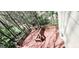 The wooden deck overlooks a heavily wooded backyard, creating a private oasis at 3626 Lone Indian Trl, Marietta, GA 30066
