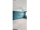 Well-lit room with a ceiling fan and wall shelves for display and storage at 3626 Lone Indian Trl, Marietta, GA 30066
