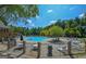 Large community pool with a view of the clubhouse and surrounding trees at 3626 Lone Indian Trl, Marietta, GA 30066