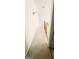 Hallway with light-colored carpet leading to the staircase with wooden railing at 3626 Lone Indian Trl, Marietta, GA 30066