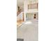 Bright living room with carpeted floors, grand staircase and views to dining area at 3626 Lone Indian Trl, Marietta, GA 30066