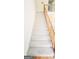 Carpeted staircase with wood railing leading to the upper level at 3626 Lone Indian Trl, Marietta, GA 30066
