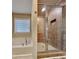 Bathroom with a separate tub and tiled glass-enclosed shower at 3713 Upland Dr, Mcdonough, GA 30253