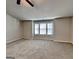 Large bedroom featuring neutral walls, carpet, three bright windows, and a modern ceiling fan at 3713 Upland Dr, Mcdonough, GA 30253