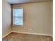Carpeted bedroom with neutral walls featuring a bright window at 3713 Upland Dr, Mcdonough, GA 30253