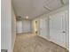 Spacious bonus room features neutral walls and carpet flooring, with a bathroom entrance visible at 3713 Upland Dr, Mcdonough, GA 30253