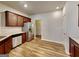 Well-equipped kitchen with stainless steel appliances, granite countertops, wood cabinets, and stylish wood-look flooring at 3713 Upland Dr, Mcdonough, GA 30253
