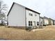 The exterior of the home showcases a well-maintained backyard with a modern design at 2275 Church St, Hampton, GA 30228