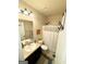 Bathroom with a single sink, vinyl floors, and a shower at 2275 Church St, Hampton, GA 30228
