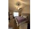 Cozy bedroom with carpeted floors, a ceiling fan, and a tufted headboard for a luxurious touch at 2275 Church St, Hampton, GA 30228