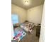 Carpeted bedroom with neutral walls and a playpen at 2275 Church St, Hampton, GA 30228