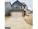 Charming two-story home with a two-car garage and neutral color scheme at 2275 Church St, Hampton, GA 30228